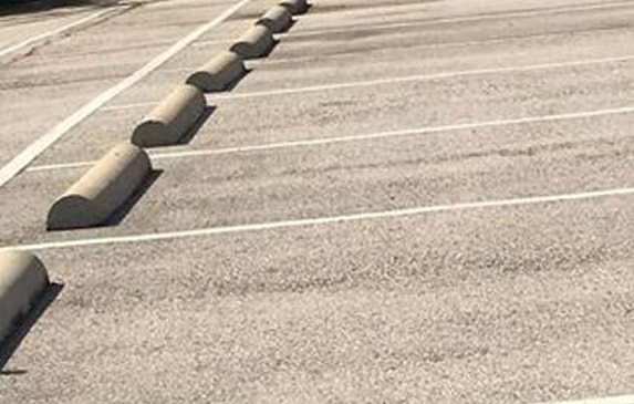Parking lot striping and wheel stop installation in El Paso, TX